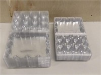 Packs of plastic egg cartons