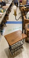A combination side table/lamp/magazine rack w/no