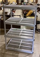 Four tier plastic shelf rack measures 54 x 36 x