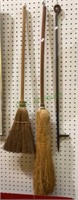 Lot includes vintage fireplace brooms and an
