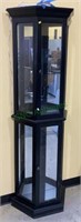 Lighted curio cabinet with four glass shelves.