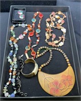 Tray lot of costume jewelry includes a wooden