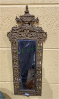 Antique oriental themed metal and beveled mirror