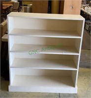 Painted wooden bookshelf with four shelves
