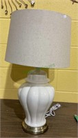 White ceramic table lamp on brass base with