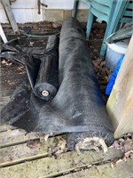 Two large rolls of garden cover.