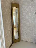 Gold framed, narrow hall mirror.
