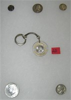Collection of silver coins includes 1 with a key c