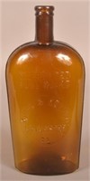 Scarce Kiehl & Keefer Embossed Amber Glass Flask.