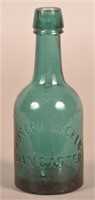 Joseph Wacker Embossed Dark Green Squat Bottle.