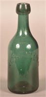 W.C. Chamberlin Embossed Dark Green Water Bottle.