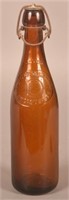Engle Bottling Works "D" Embossed Amber Bottle.