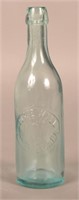 George Wall Embossed aqua Blob Top Bottle.