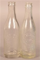 Two Chas. Zech Embossed Clear Crown Top Bottles.