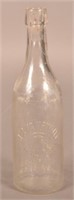 August Krimmel Embossed Clear Blob Top Bottle.