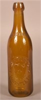 Empire Bottling Works Embossed Honey Amber Bottle
