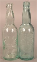 (2) Wacker Bros. Embossed Aqua Bottles.