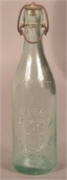 John F. Bair Embossed Aqua Blob Top Bottle.