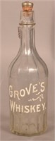 Grove's Whiskey Clear Paneled Back Bar Bottle.