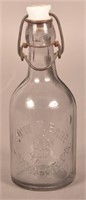 John F. Bair Embossed Clear Blob Top Pony Bottle.
