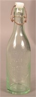Charles Hain Embossed Aqua Blob Top Bottle.