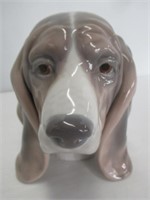 Lladro dog figure. Measures 5 1/2" tall.