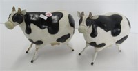 (2) Metal cow figures. Measures 6 3/4" tall.