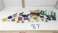 Toy plastic farm animals and primitive wagon