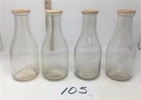 Four vintage unmarked milk bottles