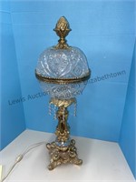 Vintage cut glass globe lamp base is metal and