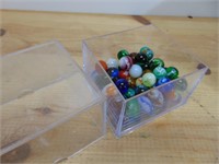 Display case with marbles