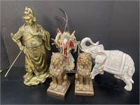 TH REE ASIAN FIGURINES AND RESIN LION BOOKENDS