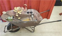 Metal Wheelbarrow with Garden Accessories. A few