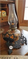 Antique glass oil lamp w/ cast iron wall Mount.
