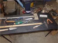 Garden tools, ax and garbage can
