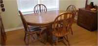Oak dining table and four chairs.