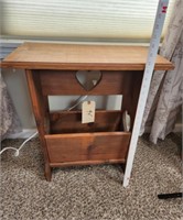 Side table with book or magazine holder.