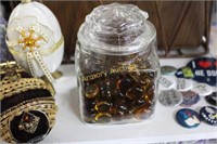 JAR OF AMBER GLASS MARBLES
