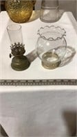 Vintage glass pitchers, vintage kerosene lamp.