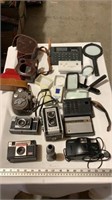 Vintage cameras ( untested), magnifying glasses,
