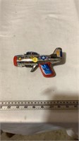 Vintage tin lithograph airplane toy.