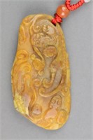 Chinese Carved Yellow Hardstone Chilong Pendant