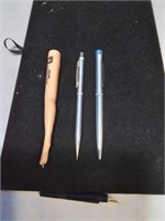 Group of four writing instruments one shaped l
