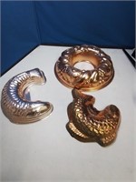 Group of three copper molds two are fish