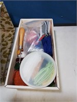Box with yarn and a krewl hook