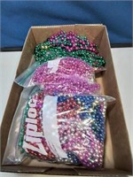 Flat with bags of Mardi Gras beads