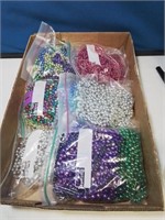 Flat with bags of Mardi Gras beads
