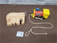 Vintage Fisherprice train and a wood elephant toy