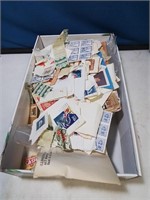 Shoebox full of a variety of stamps