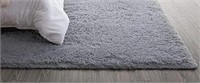 Large grey fuzzy area rug